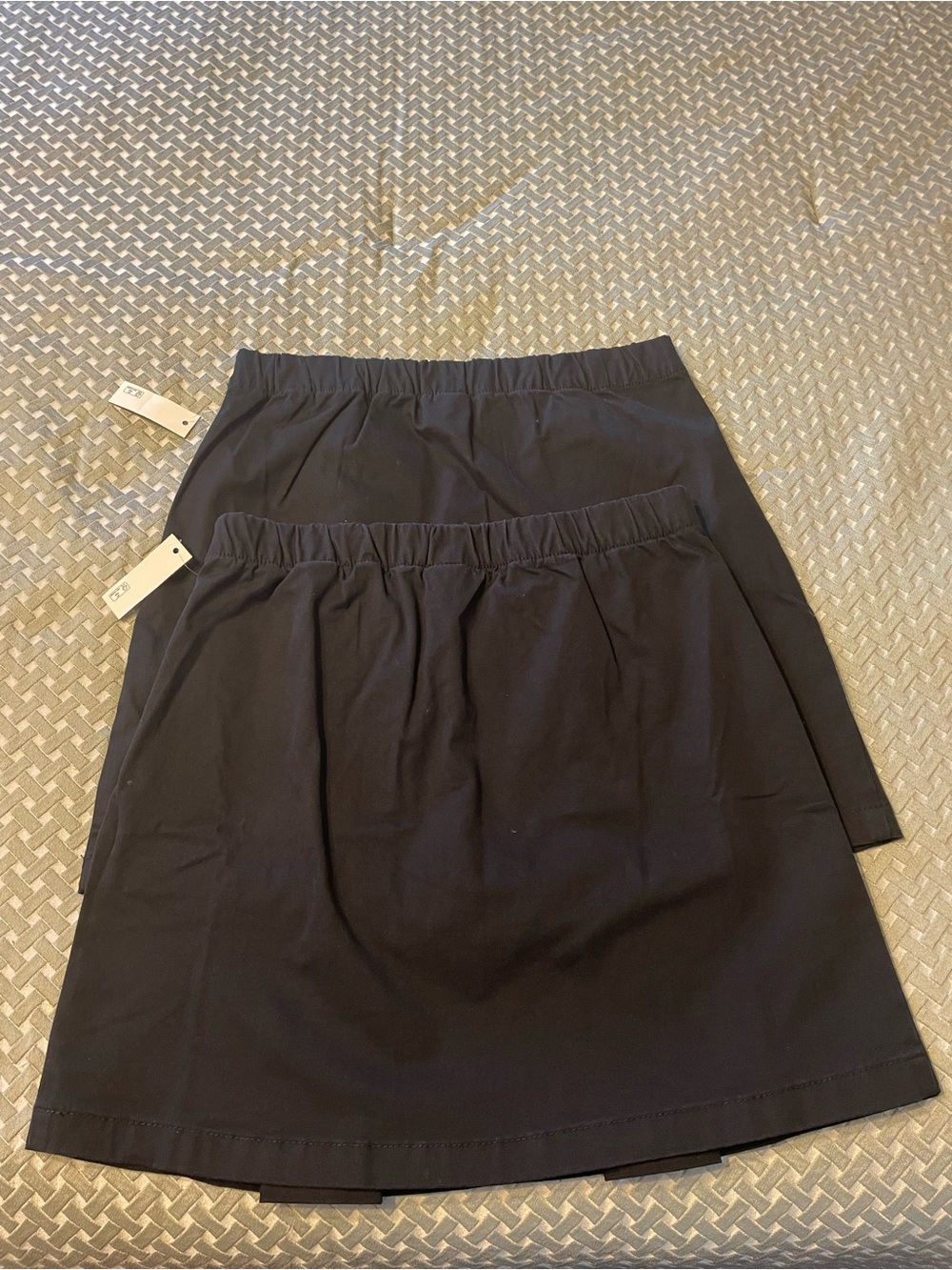 Girls black uniform scooter skirts size Large. Brand new.